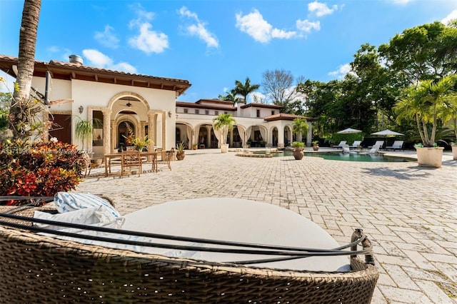 back of property featuring a patio area