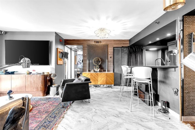 living room with an inviting chandelier