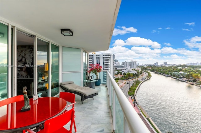 balcony featuring a water view