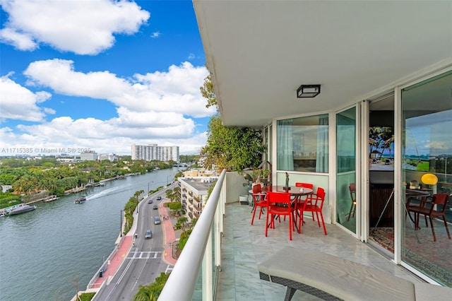 balcony featuring a water view