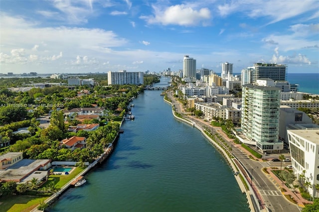 birds eye view of property featuring a water view