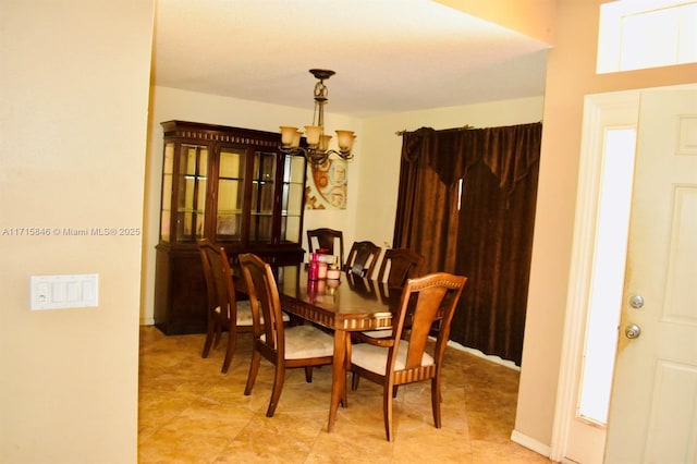 dining room featuring a notable chandelier