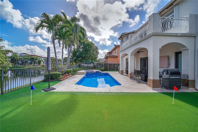 view of swimming pool with an in ground hot tub, area for grilling, ceiling fan, a water view, and a patio area