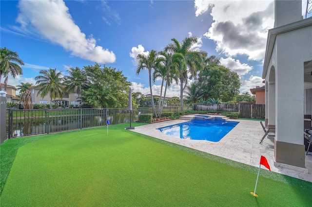 view of swimming pool featuring a patio area and a water view