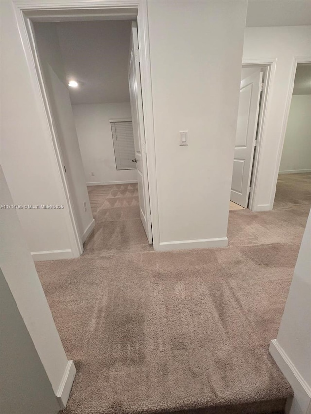 hallway with light carpet