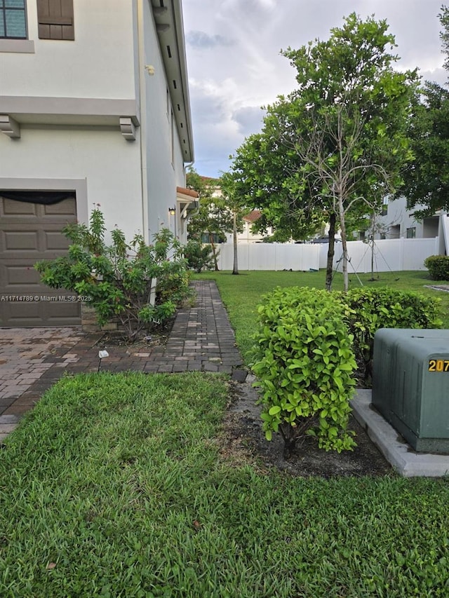 view of yard featuring a garage