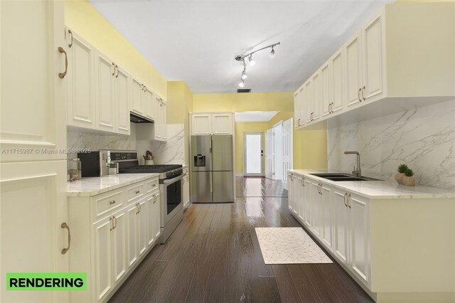 kitchen featuring white cabinetry, sink, appliances with stainless steel finishes, and tasteful backsplash