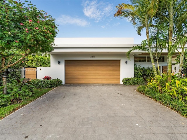 view of front of property with a garage