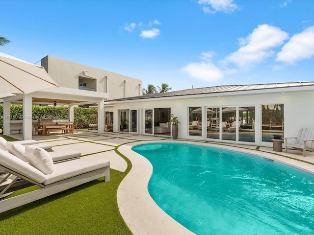 view of pool featuring a patio area