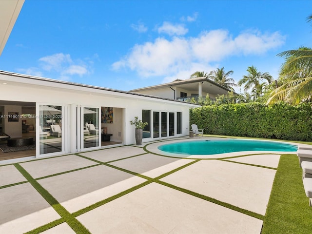 view of pool featuring a patio