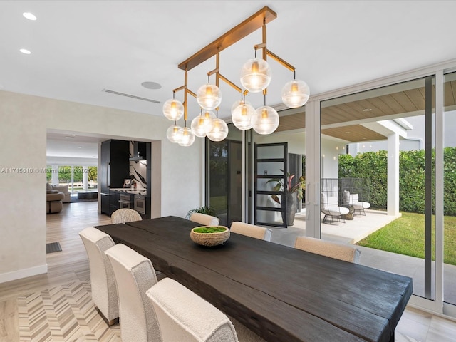 dining area featuring floor to ceiling windows