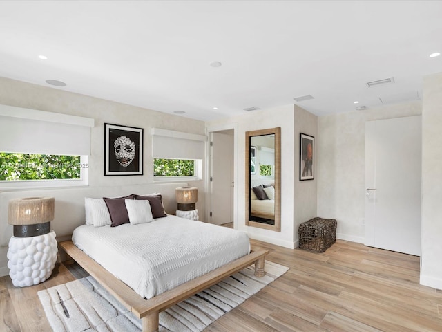 bedroom with light wood-type flooring