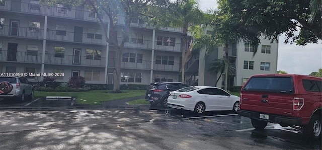 251 SW 132nd Unit 417H, Pembroke Pines, FL 33027 - view of apartment building / complex featuring uncovered parking