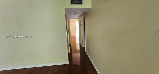 corridor featuring wood-type flooring