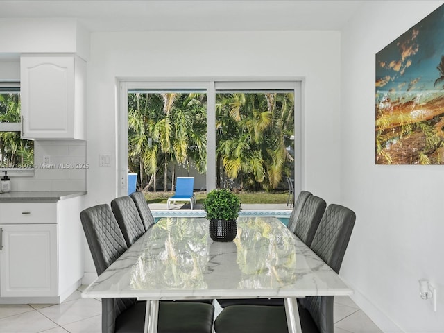 dining space featuring light tile patterned floors