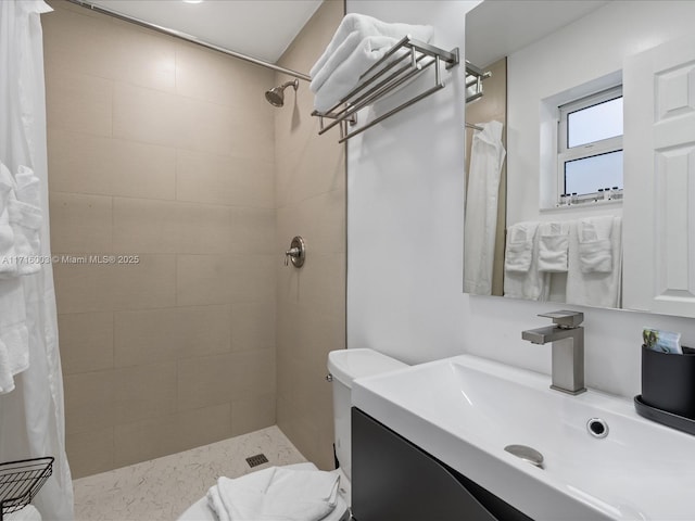 bathroom featuring vanity and curtained shower