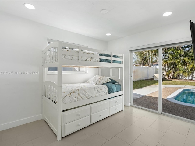 tiled bedroom featuring access to outside