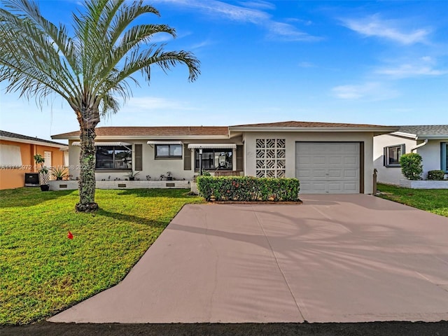 single story home featuring a front yard and a garage