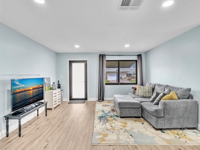 living room with light hardwood / wood-style floors