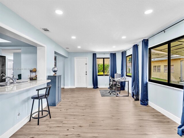 6708 NW 58th Ct, Tamarac, FL 33321 - interior space featuring light hardwood / wood-style floors and sink