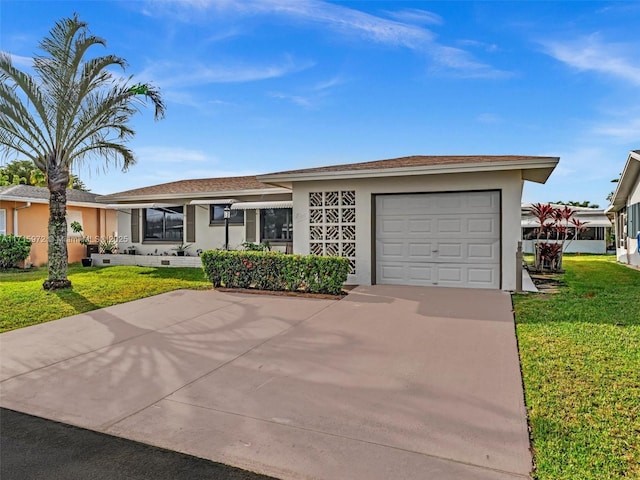 ranch-style home with a garage and a front lawn