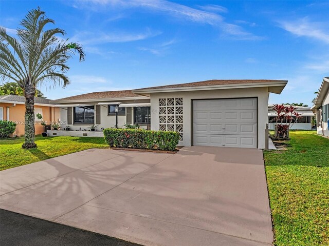 6708 NW 58th Ct, Tamarac, FL 33321 - ranch-style home with a garage and a front lawn