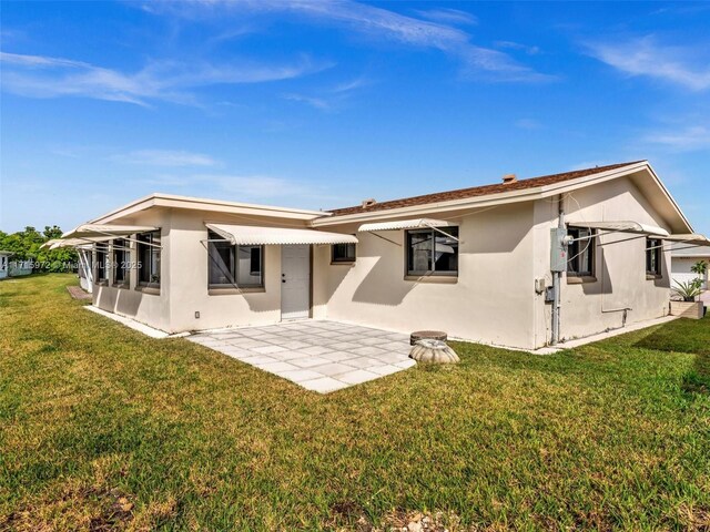 6708 NW 58th Ct, Tamarac, FL 33321 - back of house with a yard
