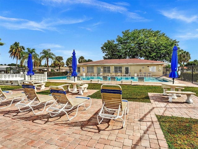 exterior space with a patio and a community pool