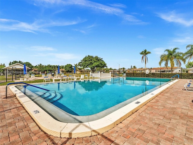 view of swimming pool with a patio area