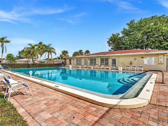 view of swimming pool with a patio area