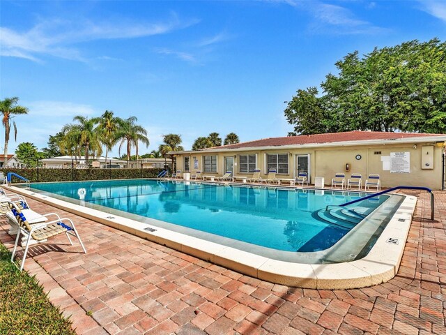 6708 NW 58th Ct, Tamarac, FL 33321 - view of swimming pool with a patio area