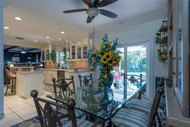 dining area with ceiling fan, light tile patterned floors, and ornamental molding