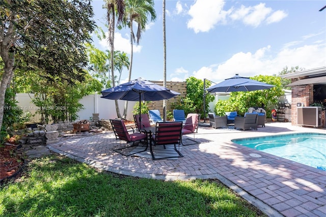 view of patio / terrace with an outdoor hangout area and a fenced in pool