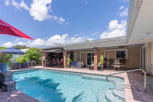 view of pool featuring ceiling fan and a patio area