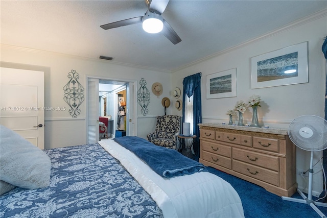 bedroom featuring dark carpet, ceiling fan, and ornamental molding