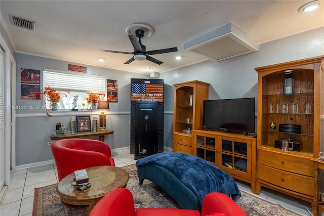 living room featuring light tile patterned floors and ceiling fan