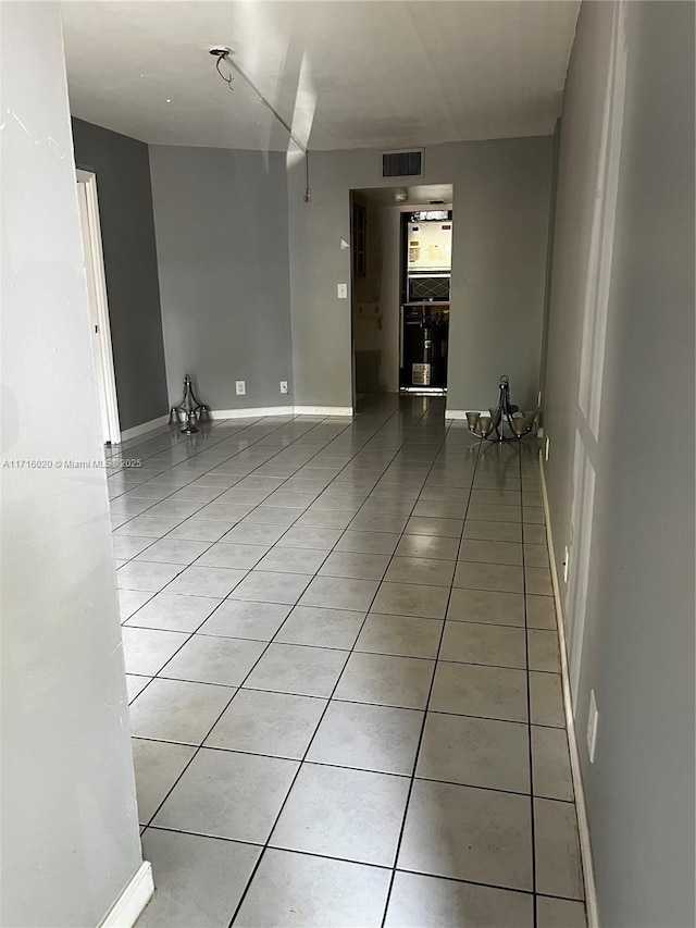 unfurnished room with light tile patterned floors