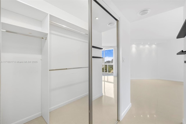 walk in closet featuring light tile patterned floors