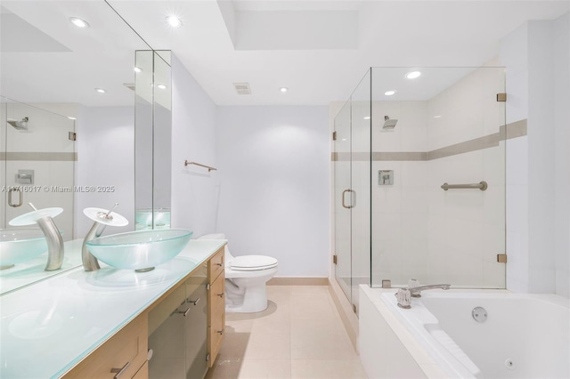 full bathroom with tile patterned floors, separate shower and tub, vanity, and toilet