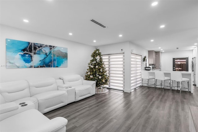 living room with dark hardwood / wood-style floors