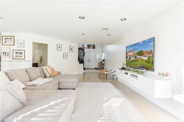 living area featuring recessed lighting and visible vents