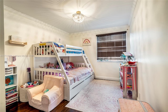 bedroom featuring crown molding, wood finished floors, a chandelier, and baseboards