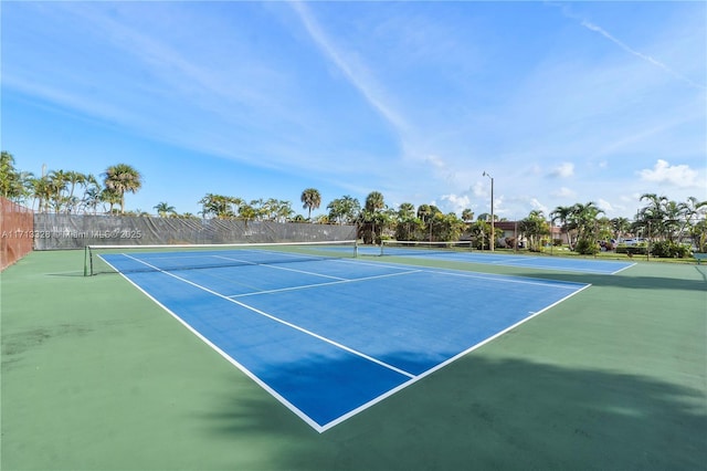 view of sport court with fence