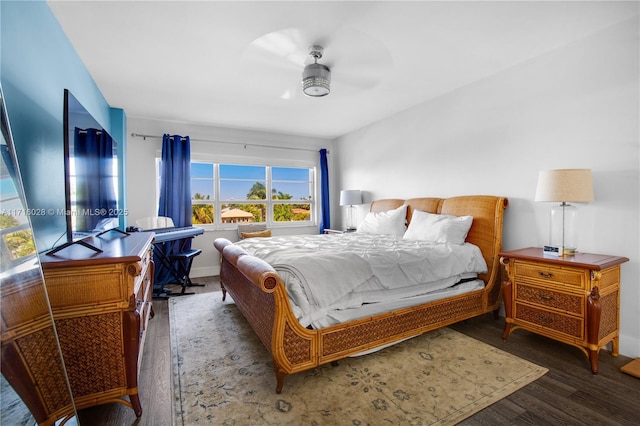 bedroom featuring ceiling fan and dark hardwood / wood-style flooring