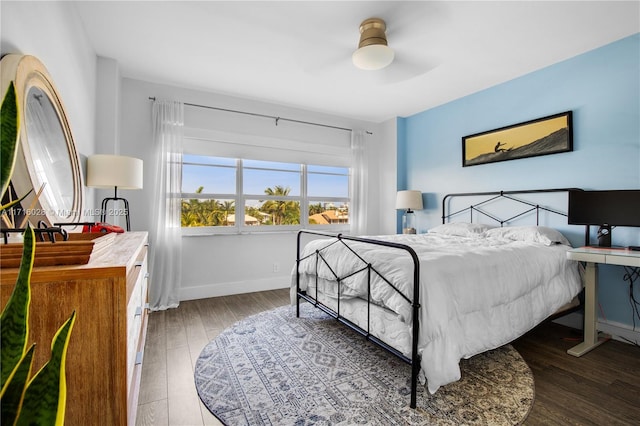 bedroom with hardwood / wood-style flooring and ceiling fan