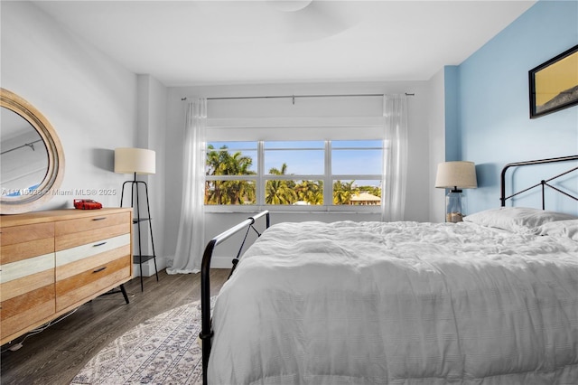 bedroom featuring dark wood-type flooring