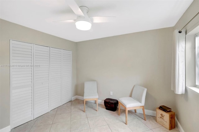 unfurnished room featuring ceiling fan and light tile patterned floors