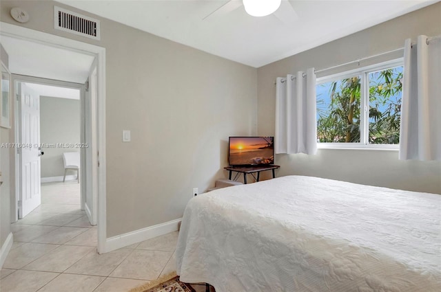 tiled bedroom with ceiling fan