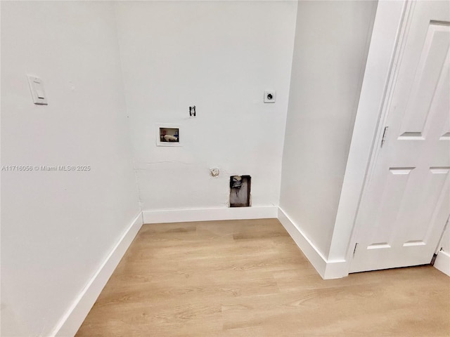 laundry room featuring hookup for an electric dryer, wood-type flooring, gas dryer hookup, and washer hookup