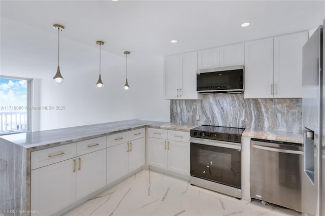 kitchen featuring kitchen peninsula, appliances with stainless steel finishes, decorative backsplash, pendant lighting, and white cabinetry